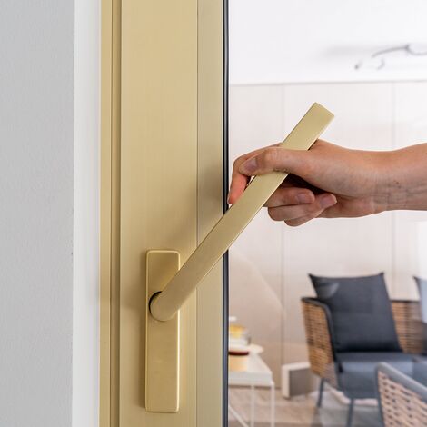 Goudkleurig aluminium schuifraam met deurkruk